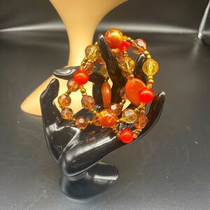 7” stretch bracelets with brown, orange, and yellow beads. Set of 3